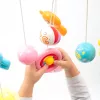 Körhinta a kiságy fölé világító vetítővel  Baby Mix piros